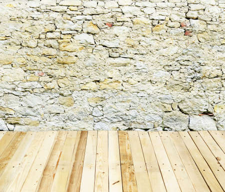 stone wall with wooden floorの写真素材