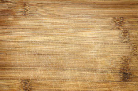 used scratched bamboo wood cutting board background detailの写真素材
