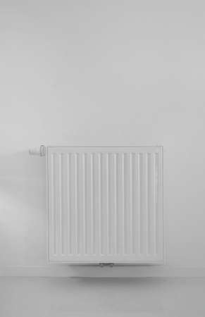 modern radiator on wall with epoxy flooringの写真素材