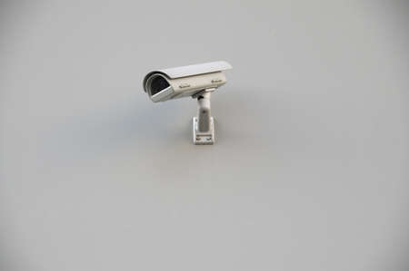 image of surveillance camera on white wallの写真素材
