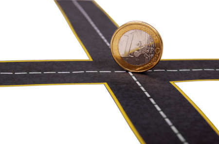 euro coin at the crossroadsの写真素材