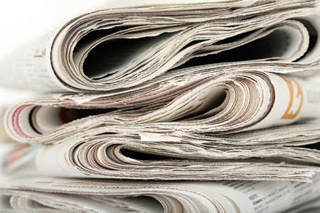 stack of folded newspapers closeup