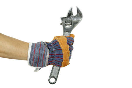 hand in protective glove with spanner isolated