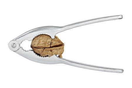 nutcracker and walnut isolated on white
