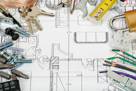 house construction concept with variety of items on blueprint