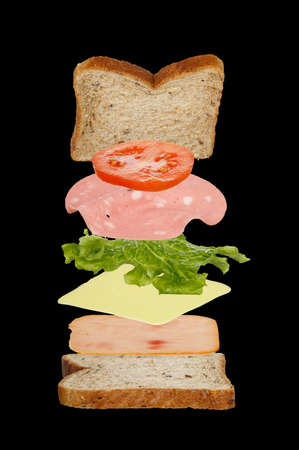 falling parts of a sandwich on blackの写真素材