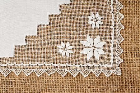 handmade doily on burlap for backgrounds