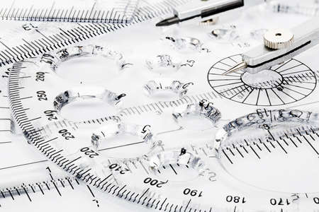transparent rulers and pair of compasses closeupの写真素材