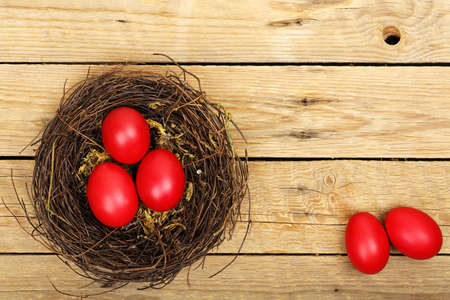 nest with easter eggs on wooden planksの写真素材