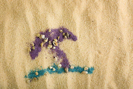 colorful sand as parasol and sea on sand surfaceの写真素材