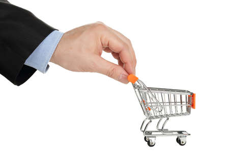 hand with shopping cart isolated on whiteの写真素材