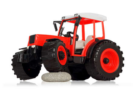 plastic toy tractor isolated on white backgroundの写真素材