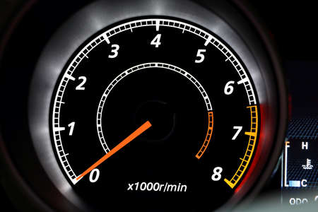 closeup of modern illuminated tachometer on blackの写真素材