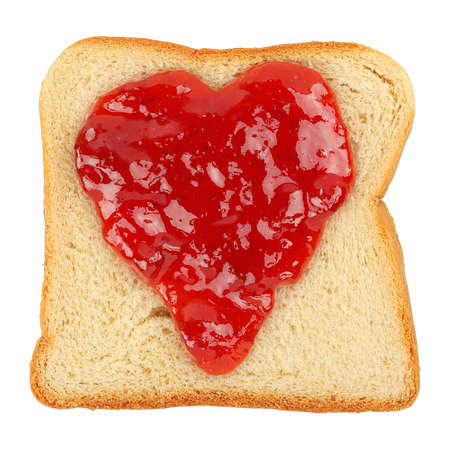 heart-shaped marmalade on bread slice isolated on whiteの写真素材