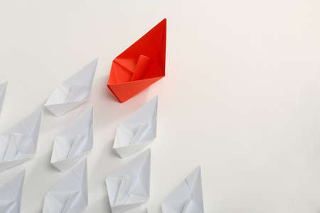red paper boat leading white ones, leadership conceptの写真素材