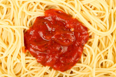 spaghetti with tomato sauce in the middleの写真素材