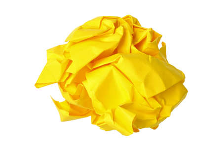 crumpled yellow paper ball isolated on whiteの写真素材