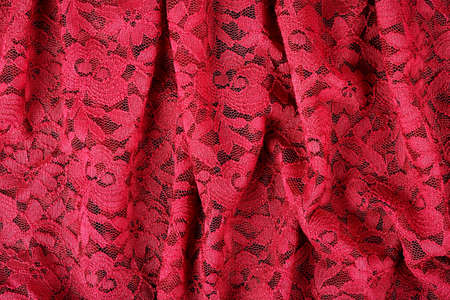 red lace with abstract folds for backgroundsの写真素材