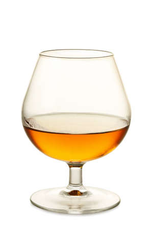 single glass of cognac isolated on whiteの写真素材
