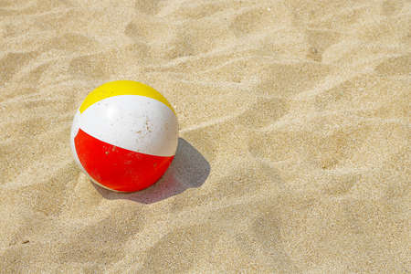 colorful plastic ball on the beachの写真素材