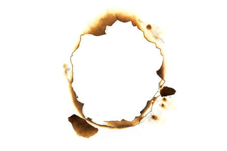 large burnt hole on paper sheet isolated on white