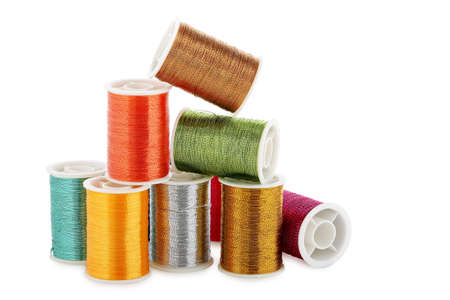 colorful spools of thread isolated on white