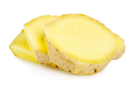 closeup of sliced ginger root isolated on whiteの写真素材