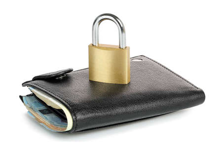 padlock on leather wallet isolated, money protection conceptの写真素材