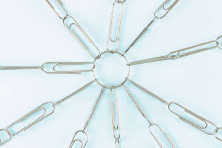 paper clips as chain linked to ring, abstract unity conceptの写真素材