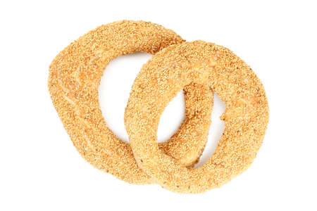 greek koulouri isolated on white, ring shaped bread roll covered with sesame seeds