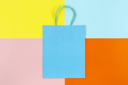 blank shopping bag on colorful paper, shopping concept or backgroundの写真素材