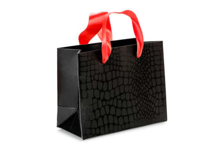luxurious black shopping bag isolated on whiteの写真素材