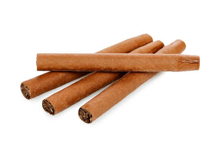 closeup of four cigars isolated on white 