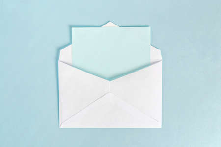 open envelope with cyan paperの写真素材