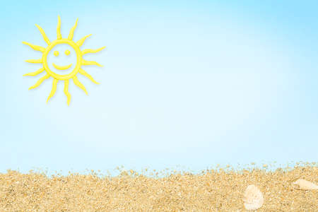 clay sun and sand on cyan paper surface, summer conceptの写真素材