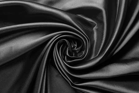 luxurious black satin fabric, abstract swirls and folds