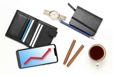 variety of men's objects on white, phone with graph, business success concept