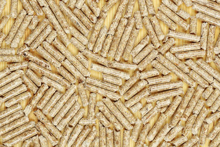wood pellets on wooden surface, alternative heatingの写真素材