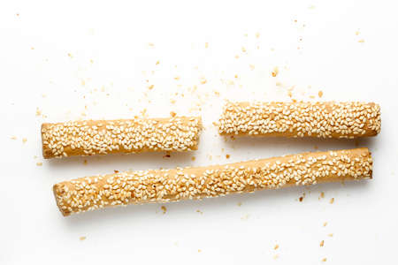 bread sticks with sesame seeds on whiteの写真素材