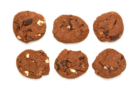 homemade chocolate cookies with hazelnuts on white