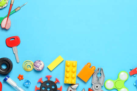 variety of toys on blue surface, top view with copy spaceの写真素材