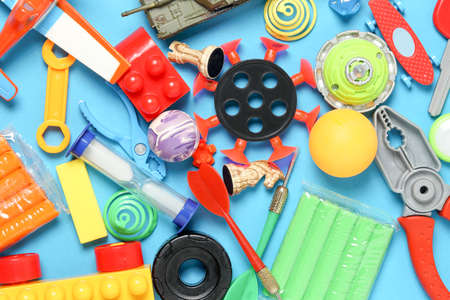 variety of toys on blue surface, top viewの写真素材