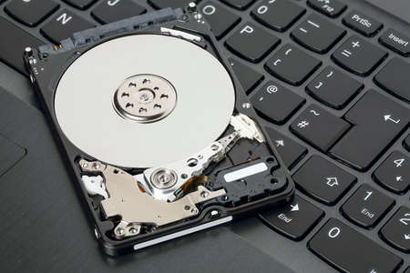 hard disc drive on keyboard of laptop