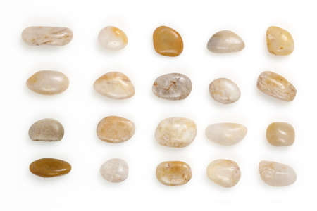 a number of pebbles on white, top view