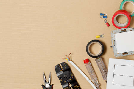 flat lay image of electrical equipment on cardboard with copy spaceの写真素材