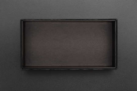 top view of empty black box on black surface