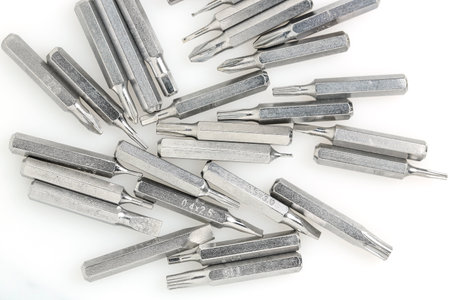 close up of metallic bits for screwdriver on whiteの写真素材