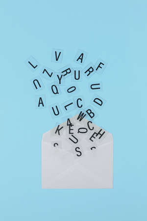letters coming out of white envelope, communication conceptの写真素材