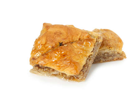 two square pieces of baklava isolated on whiteの写真素材
