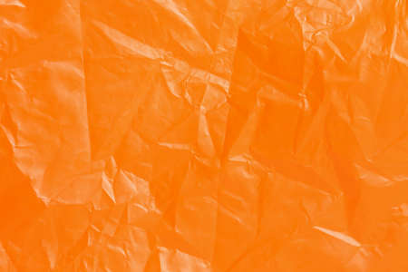 wrinkled orange plastic surface for backgroundsの写真素材